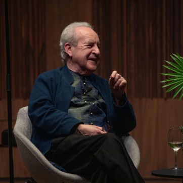 John Banville smiling on stage at the Royal Irish Academy of Music