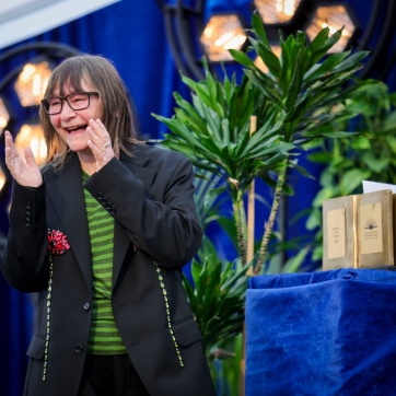 Dublin Literary Award Winner Ali Smith on stage at the ILFD alongside her trophy.