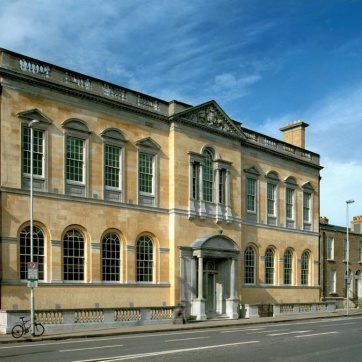 Image is an exterior photo of the Pearse Library building.