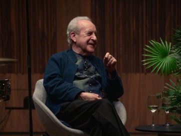 John Banville smiling on stage at the Royal Irish Academy of Music
