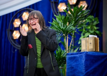 Dublin Literary Award Winner Ali Smith on stage at the ILFD alongside her trophy.