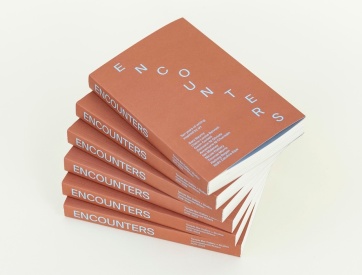 fanned stack of Encounters Vol.1
